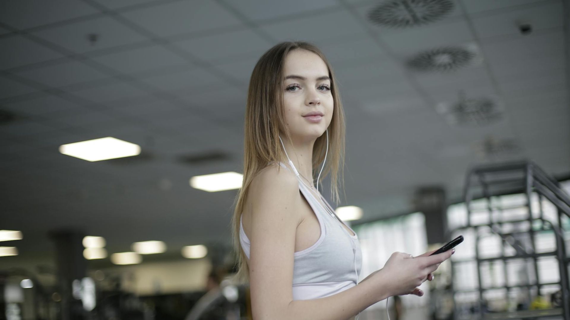 Active person moving in a bright modern gym space