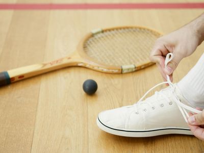 Close up of sports shoes on wooden floor