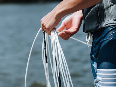 Person hands holding a fitness rope detail
